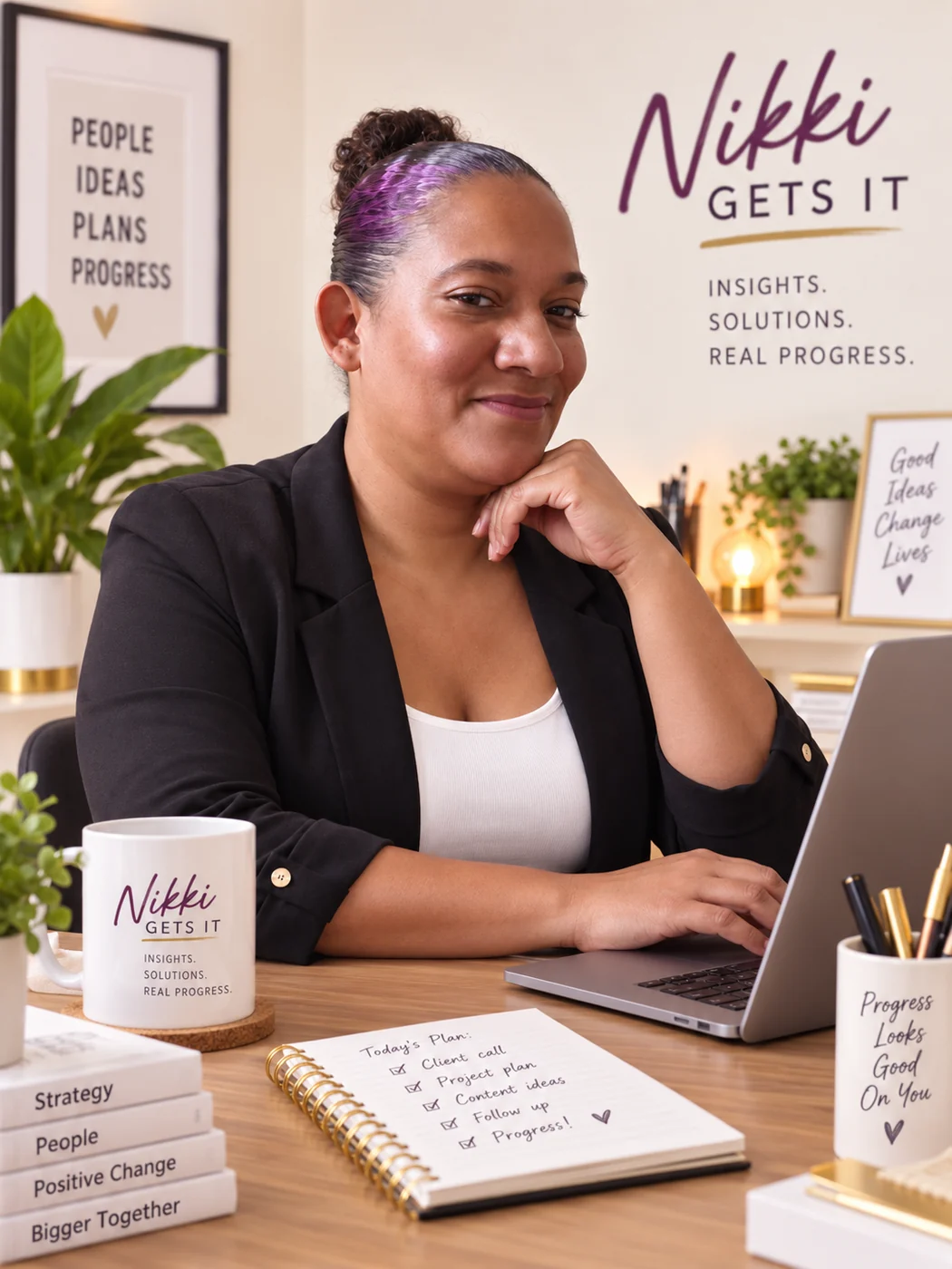 Nikki seated at a desk with a laptop
